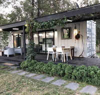 Absolute riverfront shipping container cabin